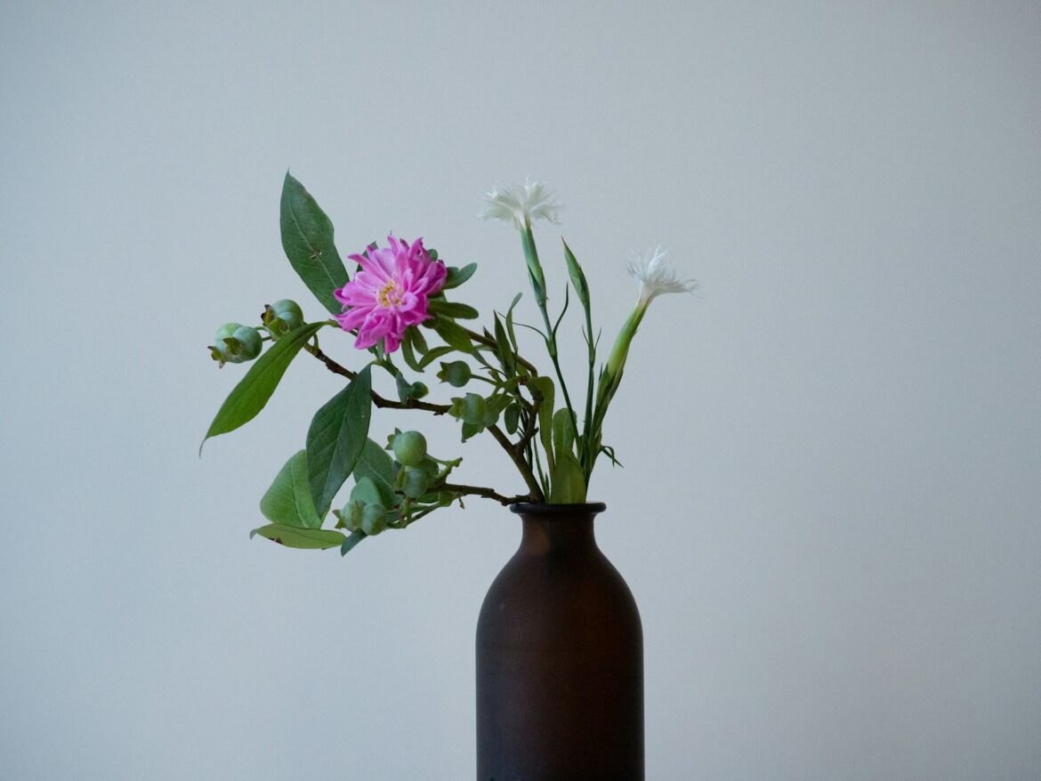 Vases & Vibes: The Best Summer Floral Arrangements This Year a vase with flowers