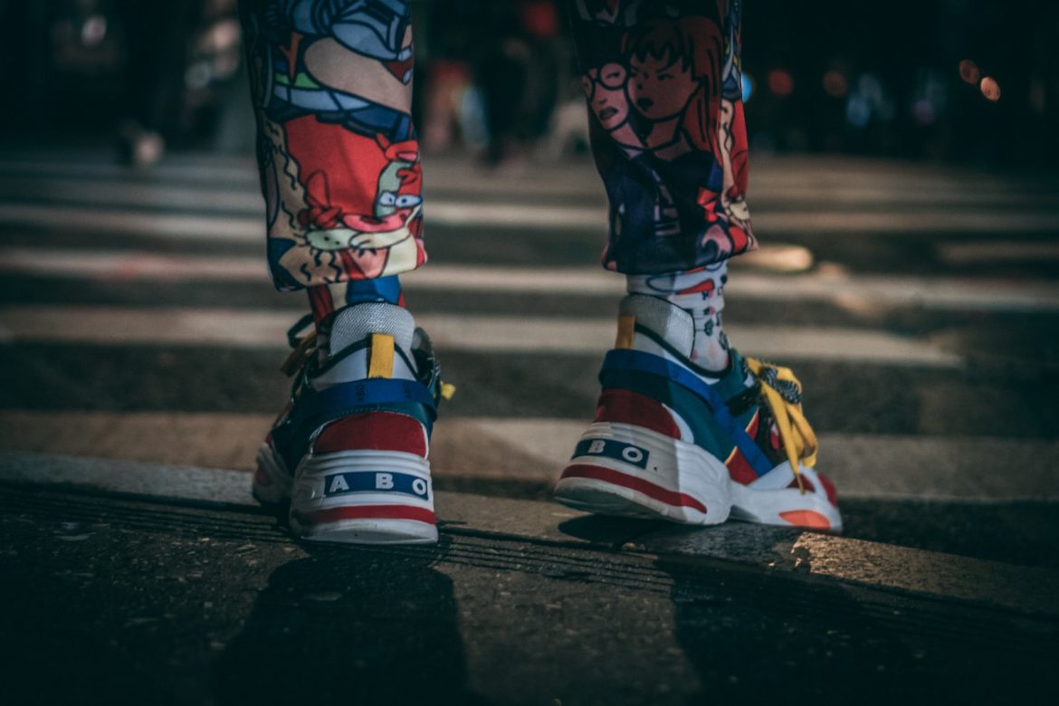 The Best Spring/Summer Fashion Items You Need person in black white and orange nike shoes