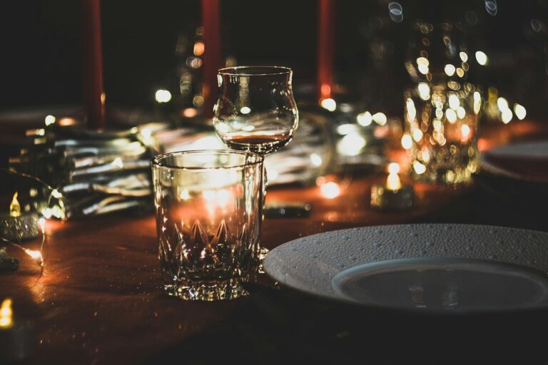 Dinner Party Theme Table Setting Ideas: Creative Inspiration for Every Occasion selective focus photography of wine glass and shot glass on table. dinner party themes. dinner party