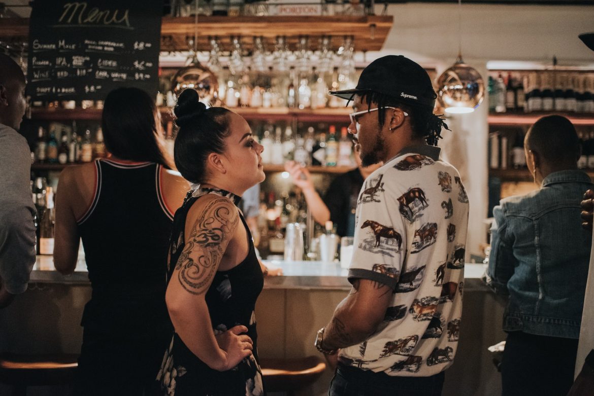 The Best Happy Hours in Nashville in October man and woman facing each other