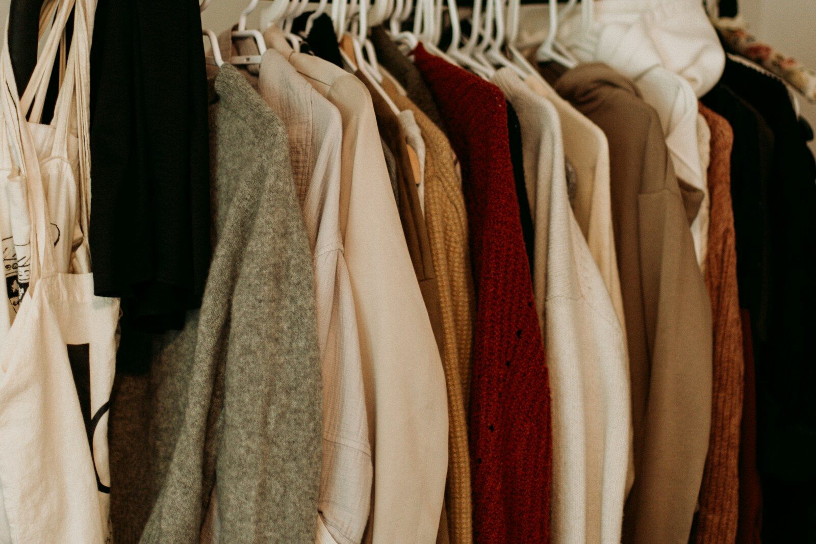 How to Build a Colorful Closet You’ll Actually Wear 1 brown and white coat hanged on rack. closet