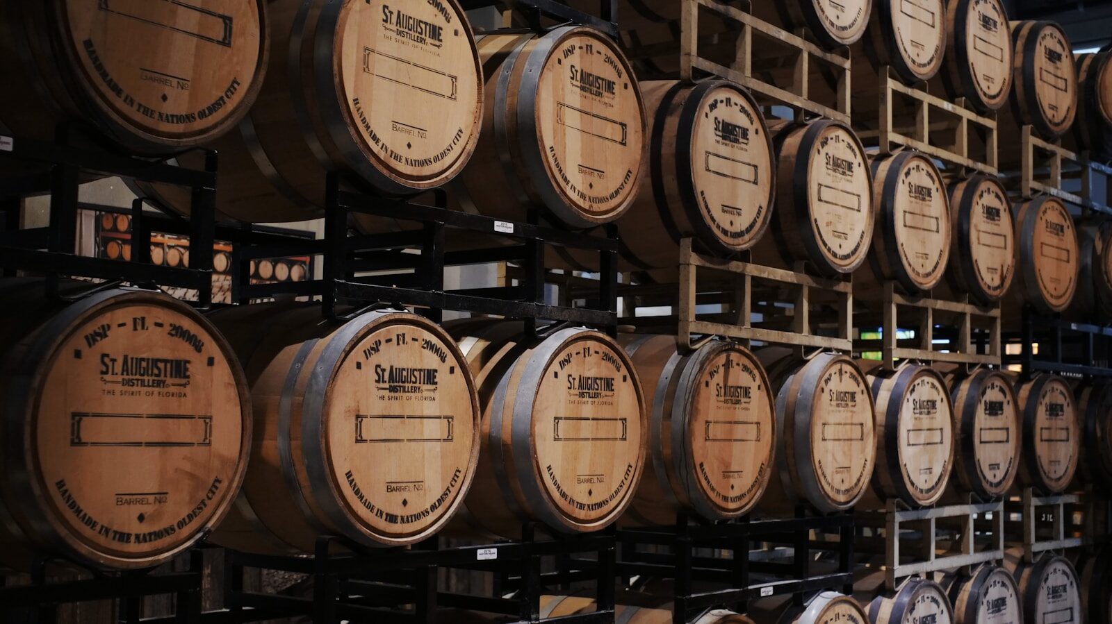 Louisville Bourbon Tastings: 19 Downtown Distilleries and Tasting Rooms 1 brown wooden barrels on rack. bourbon. bourbon tastings. louisville