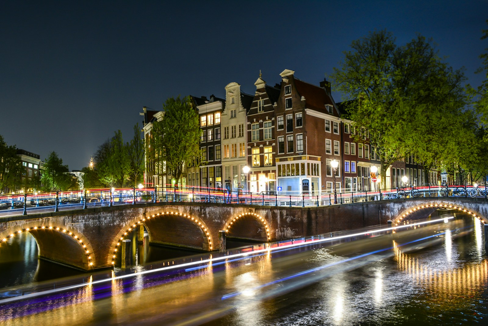 lighted city near on bridge