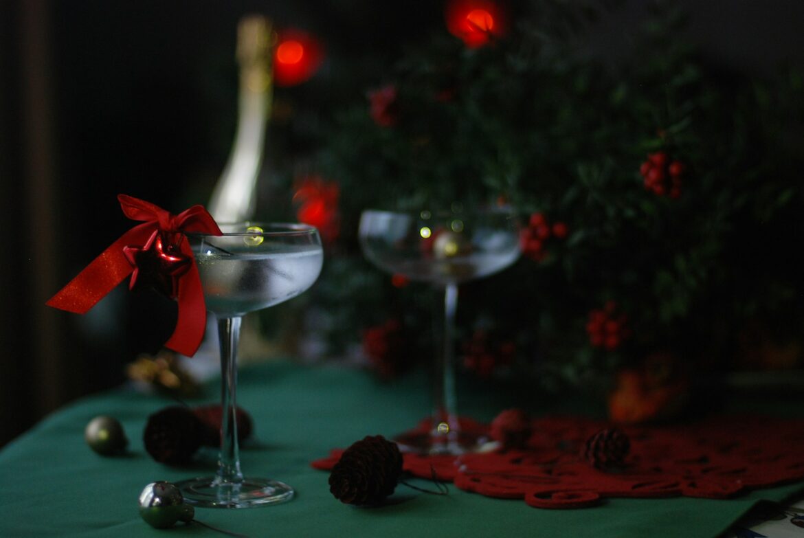 red rose on clear glass bowl. christmas martini